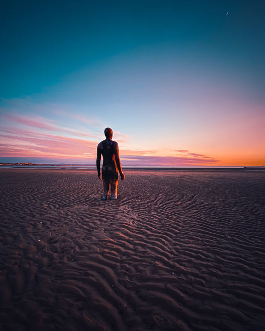 Antony Gormley's Iron Men Sunset
