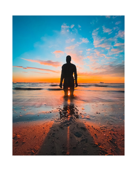 Antony Gormley's Iron Men Sunset