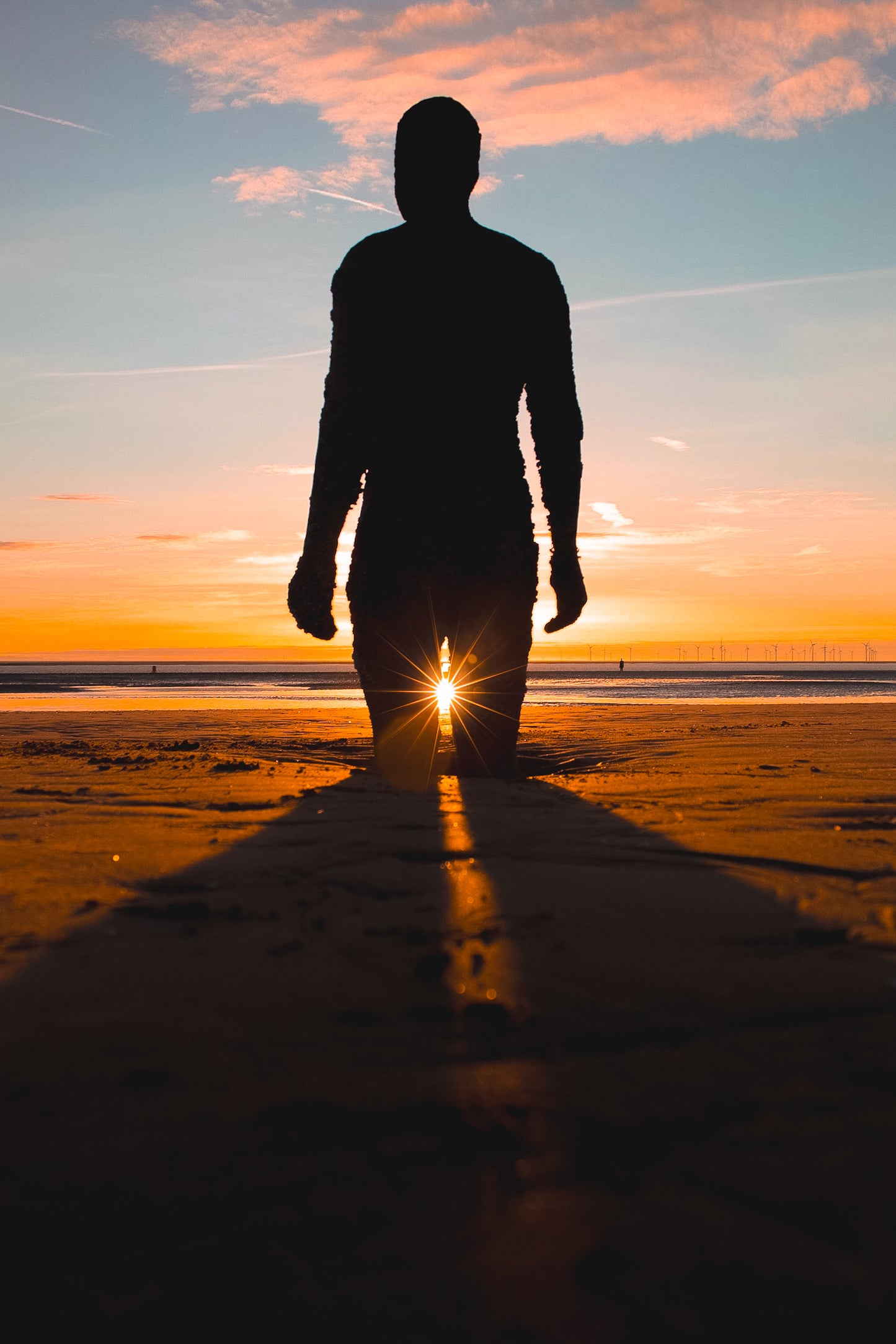 Antony Gormley's Iron Men Sunset