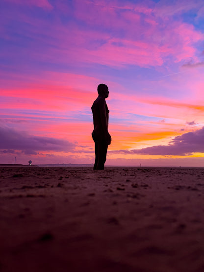 Antony Gormley's Iron Men Sunset