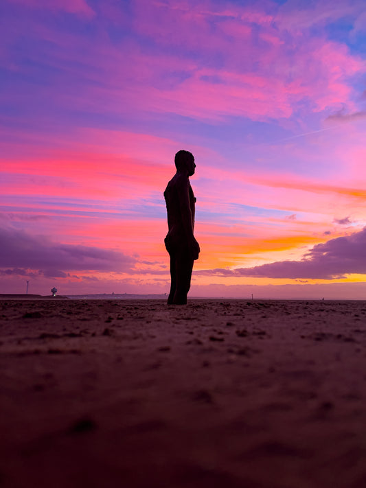 Antony Gormley's Iron Men Sunset